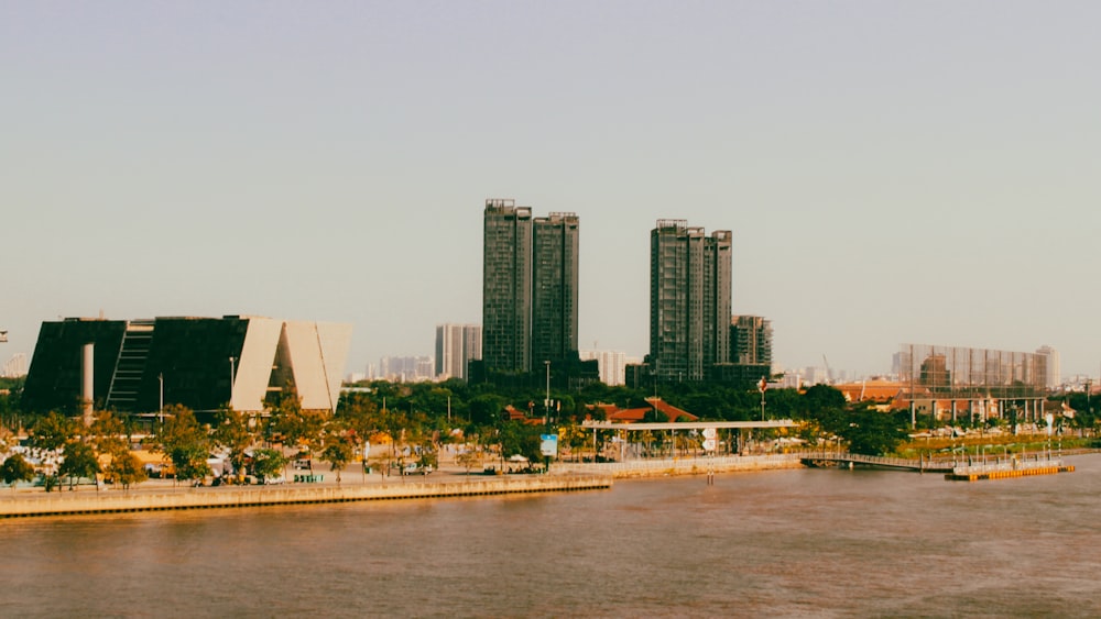 a body of water with a city in the background