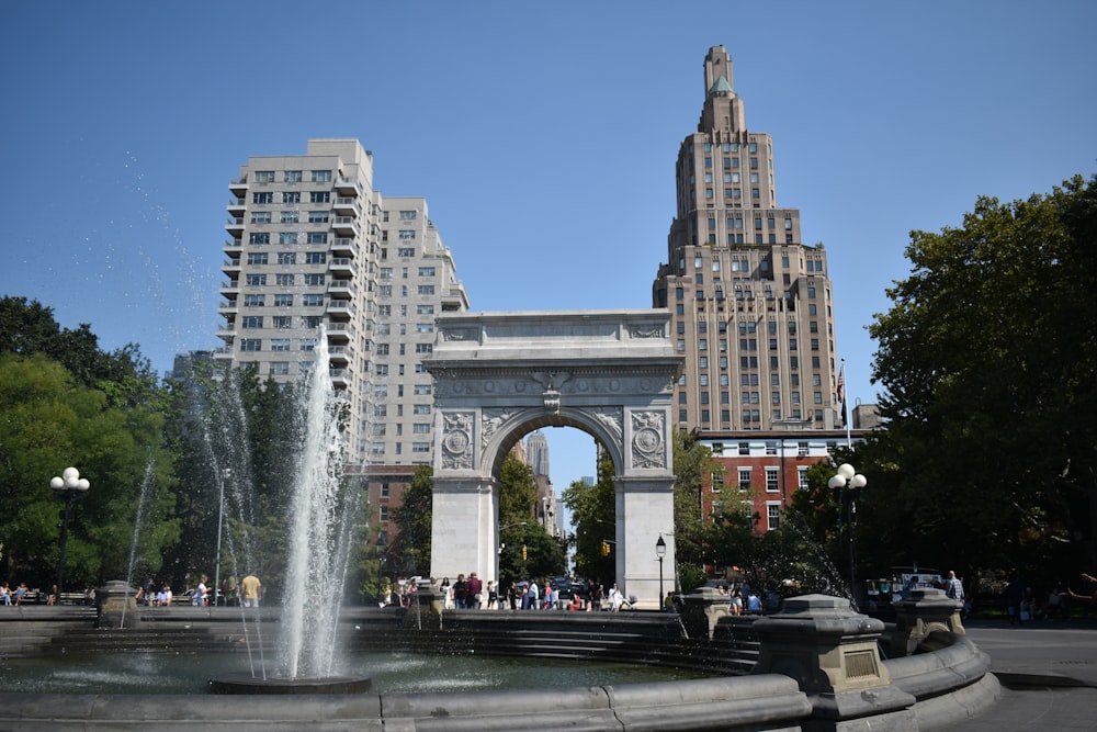 a fountain in the middle of a city square