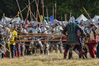 a large group of people in medieval costumes