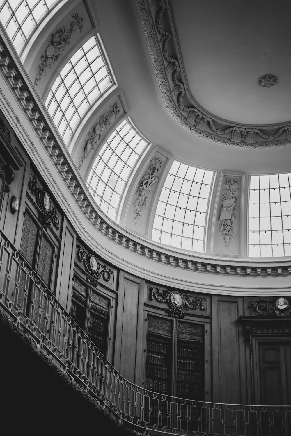 a black and white photo of a staircase in a building