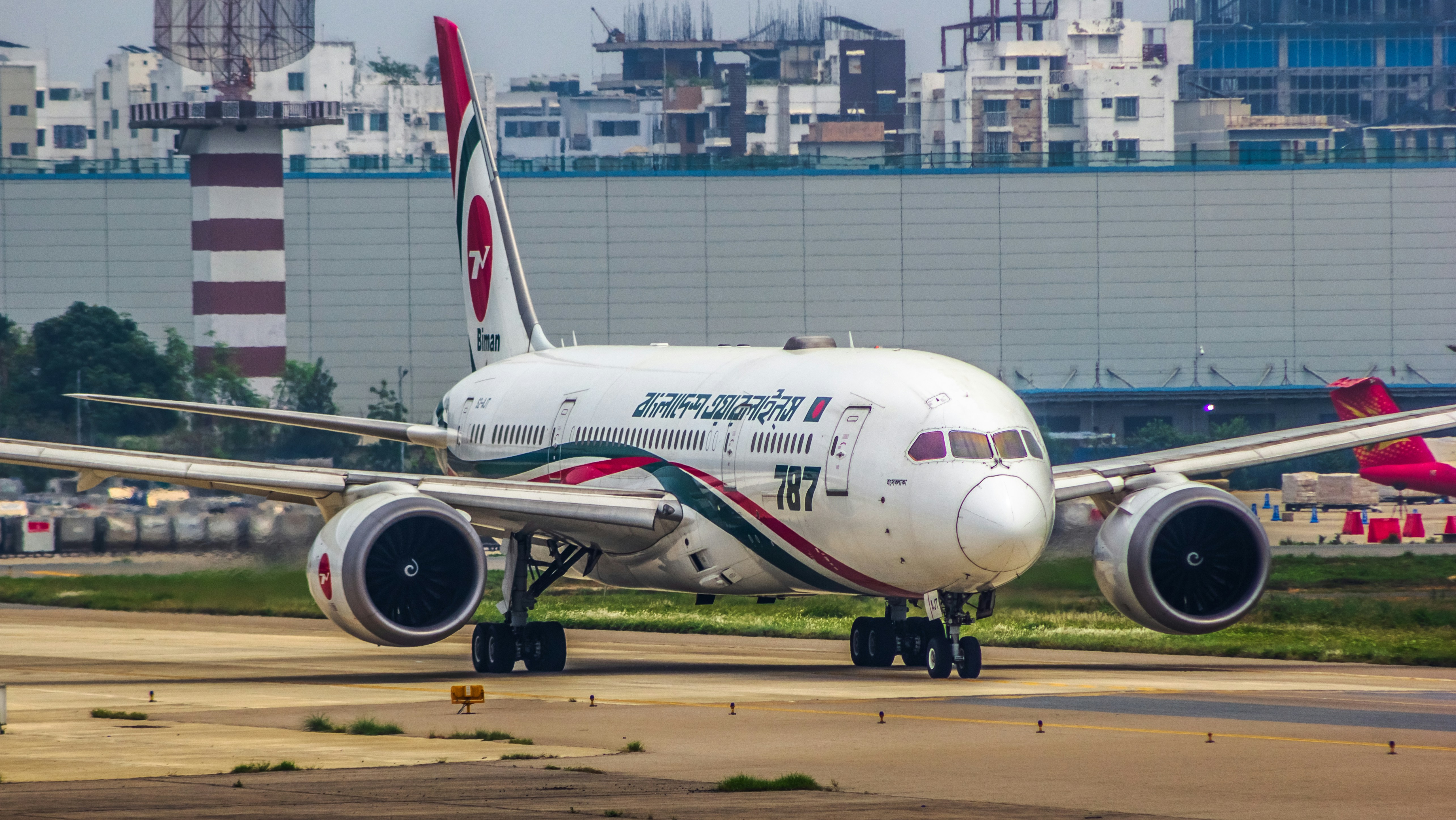 a large jetliner sitting on top of an airport tarmac, Biman Bangladesh Airlines | Boeing 787-8 Dreamliner