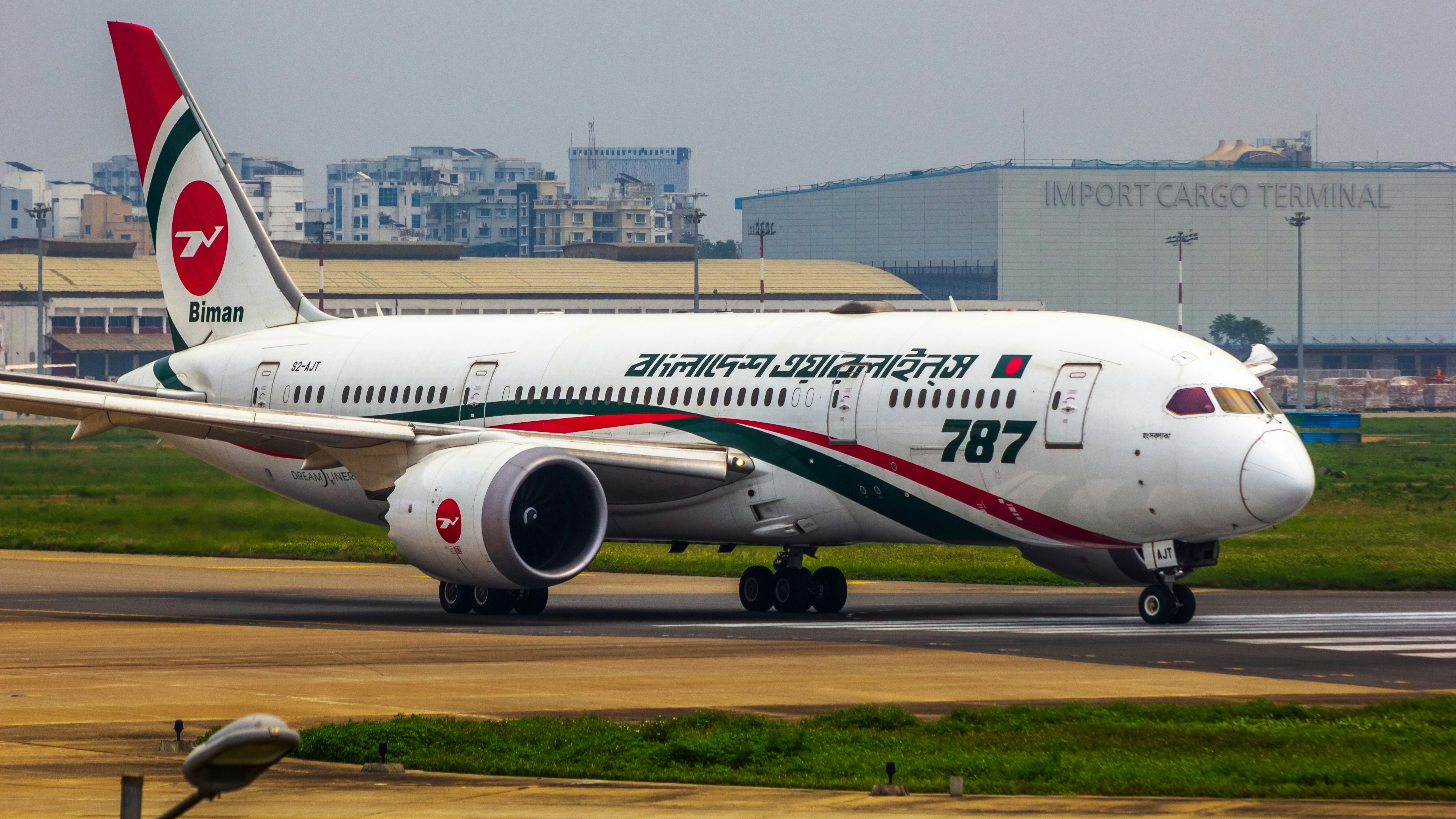 a large jetliner sitting on top of an airport runway, Biman Bangladesh Airlines | Boeing 787-8 Dreamliner
