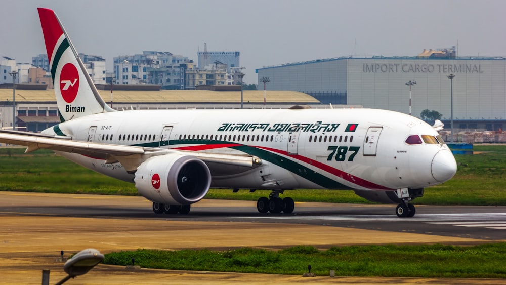 a large jetliner sitting on top of an airport runway