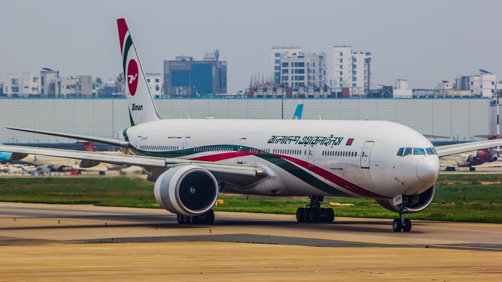 a large jetliner sitting on top of an airport runway