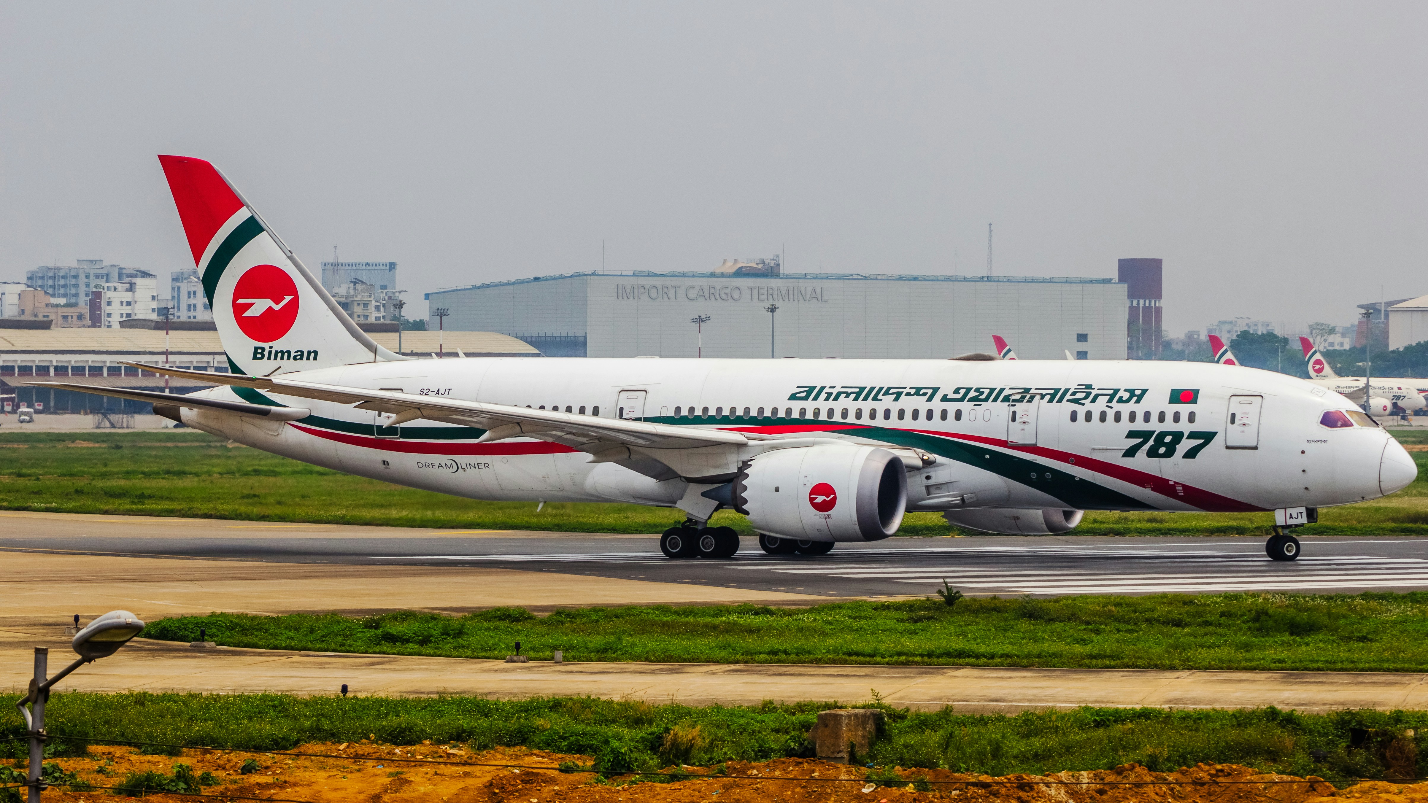 a large jetliner sitting on top of an airport runway, Biman Bangladesh Airlines | Boeing 787-8 Dreamliner