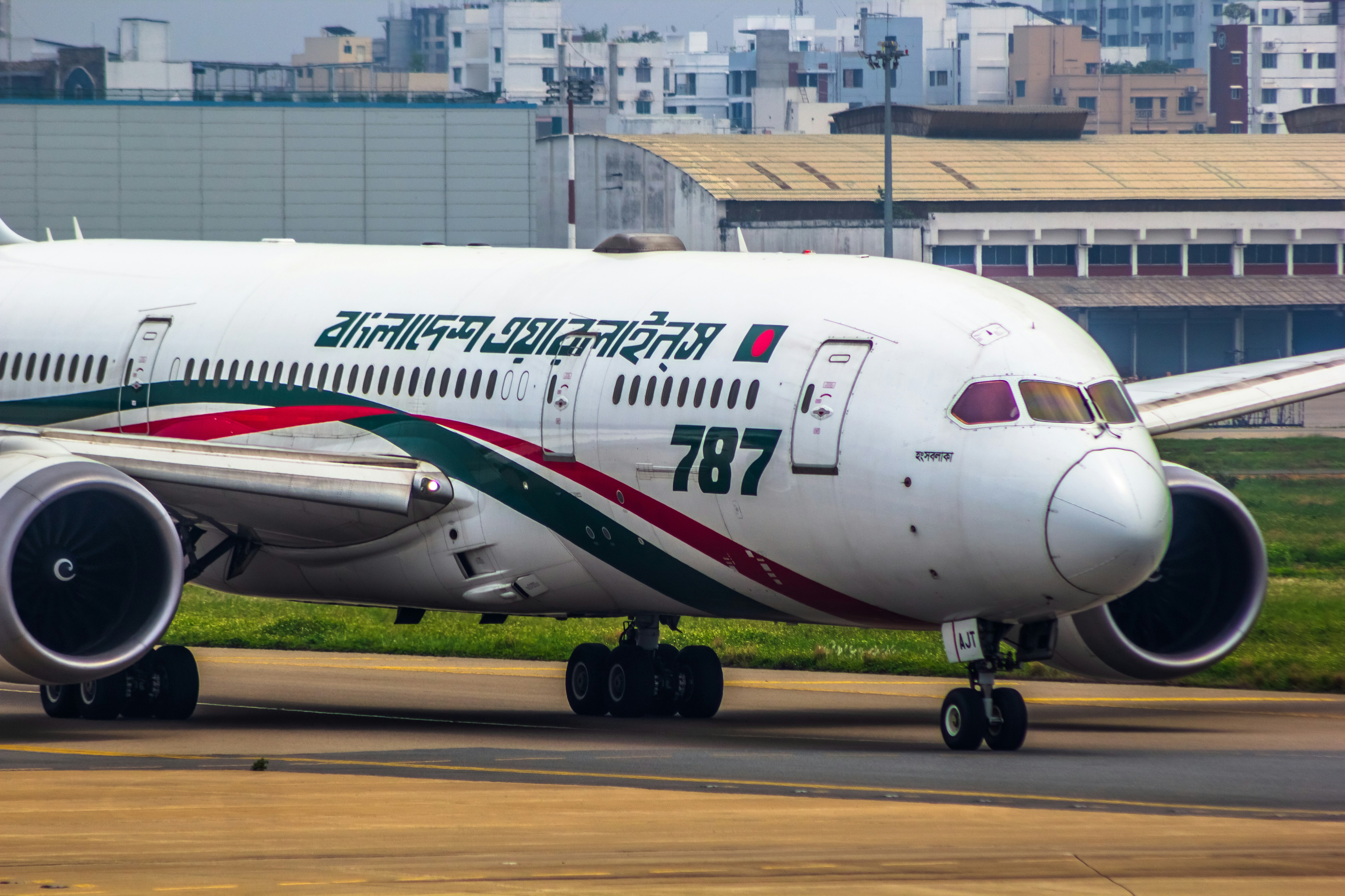 a large jetliner sitting on top of an airport runway, Biman Bangladesh Airlines | Boeing 787-8 Dreamliner