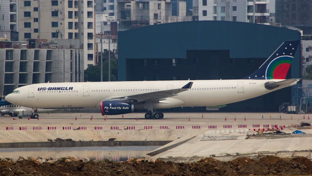 a large jetliner sitting on top of an airport tarmac