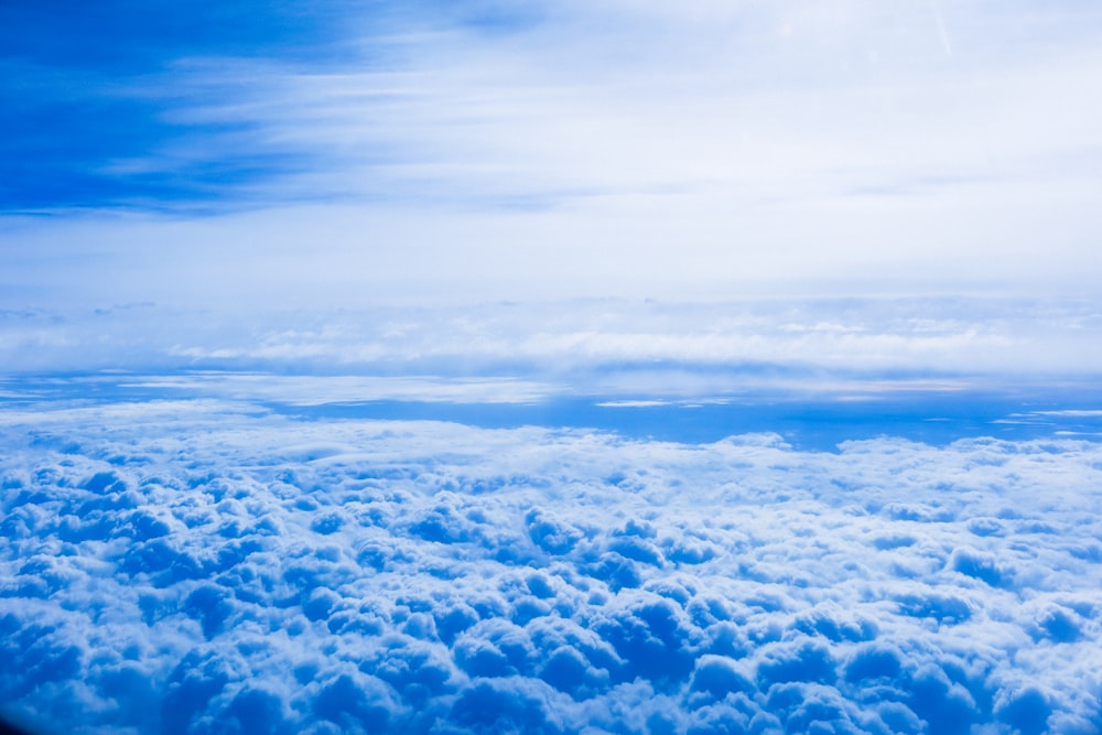 a view of the clouds from an airplane window