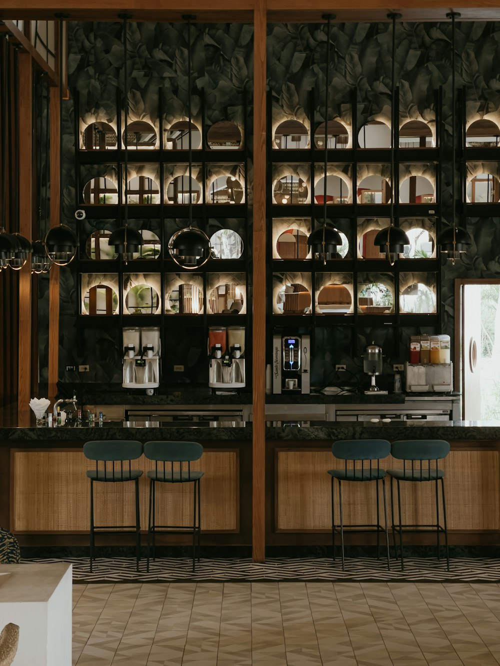 a room with a bunch of shelves and chairs