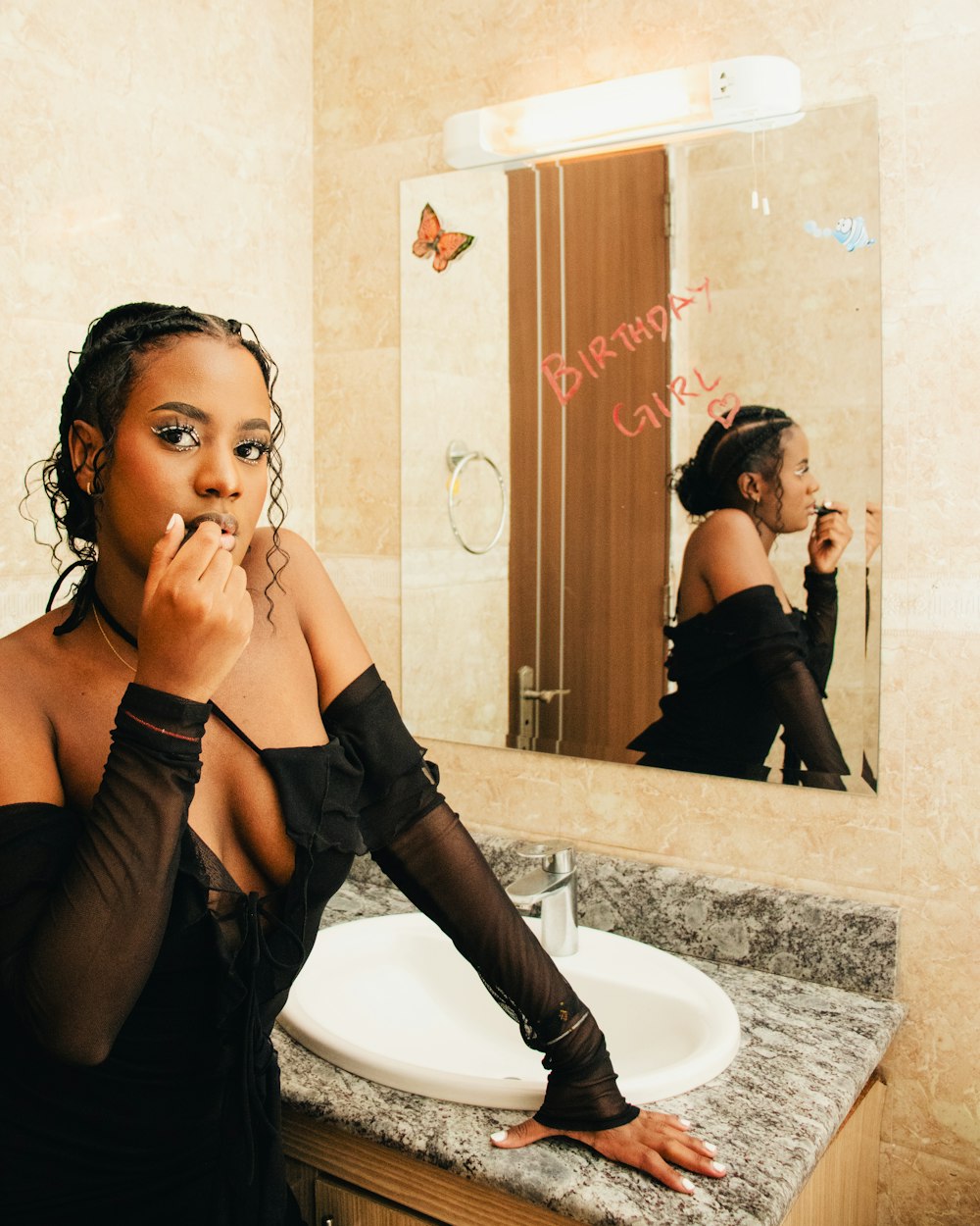 a woman brushing her teeth in front of a mirror