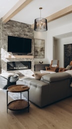 a living room filled with furniture and a flat screen tv