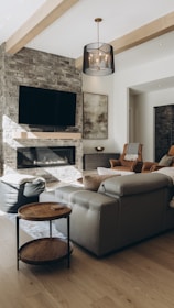 a living room filled with furniture and a flat screen tv