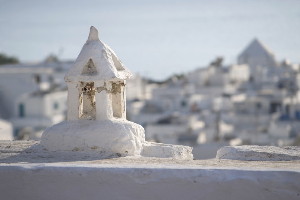 a white building with a bell tower on top of it