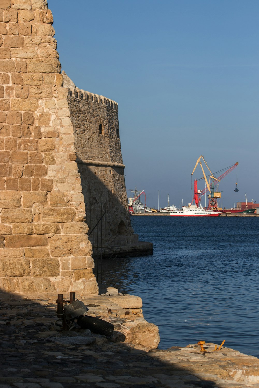 a view of a body of water with a ship in the background