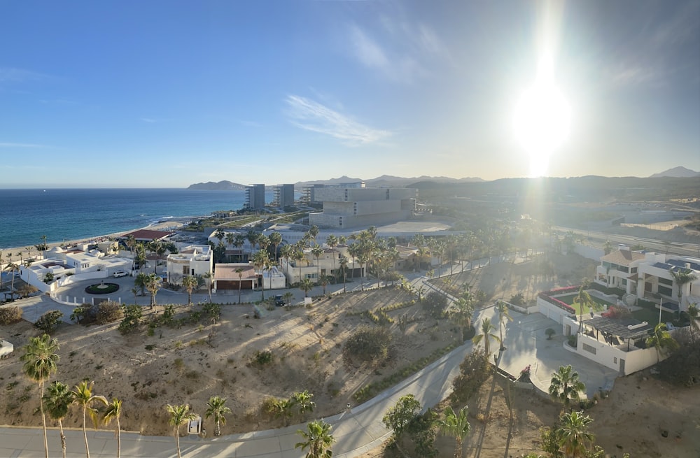 the sun shines brightly over a beach town