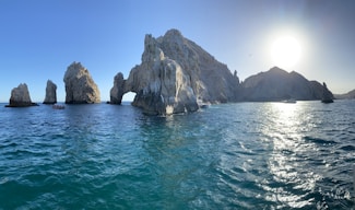 a group of rock formations in the ocean