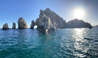 a group of rock formations in the ocean