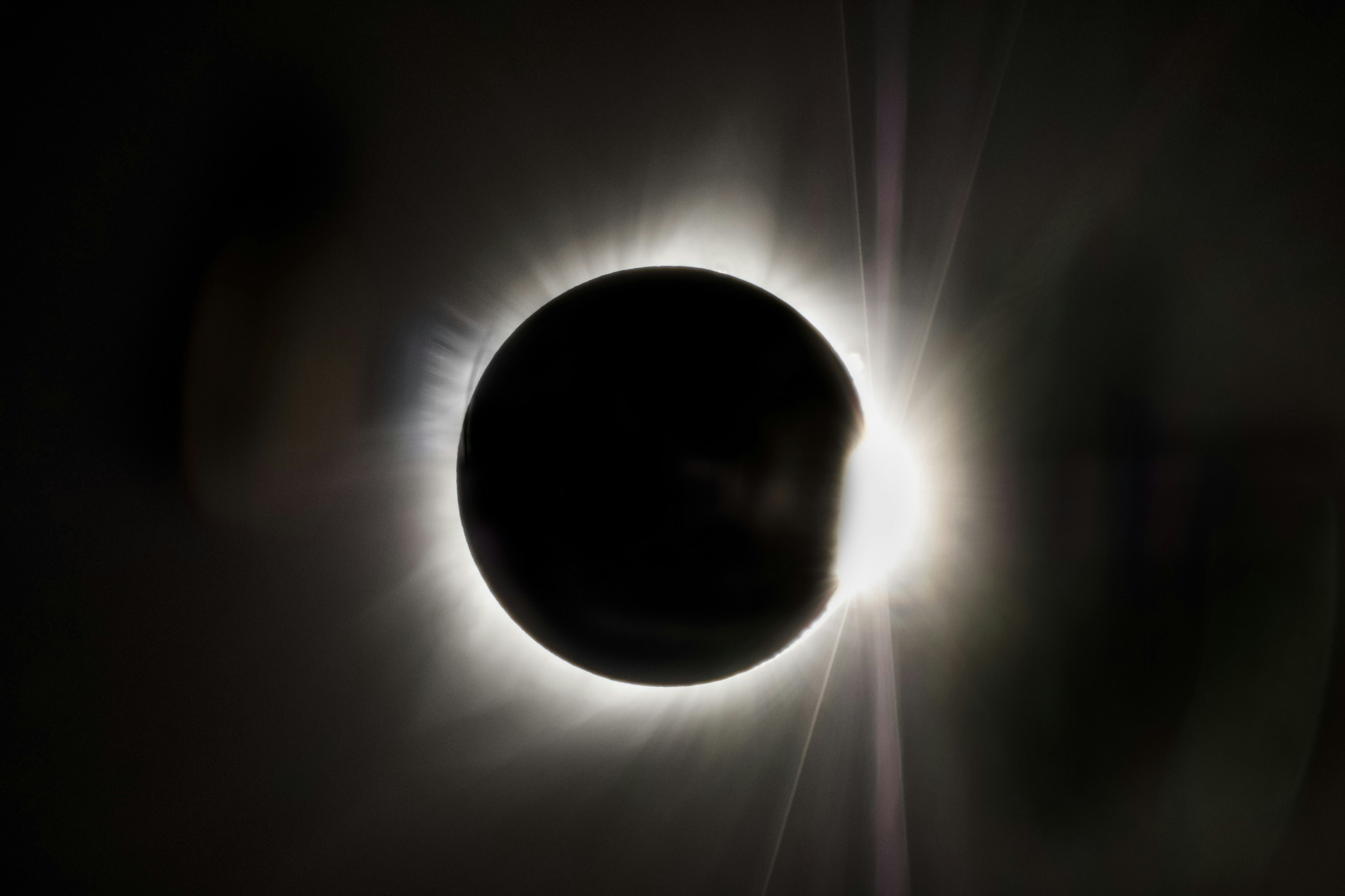 a solar eclipse is seen in the dark sky