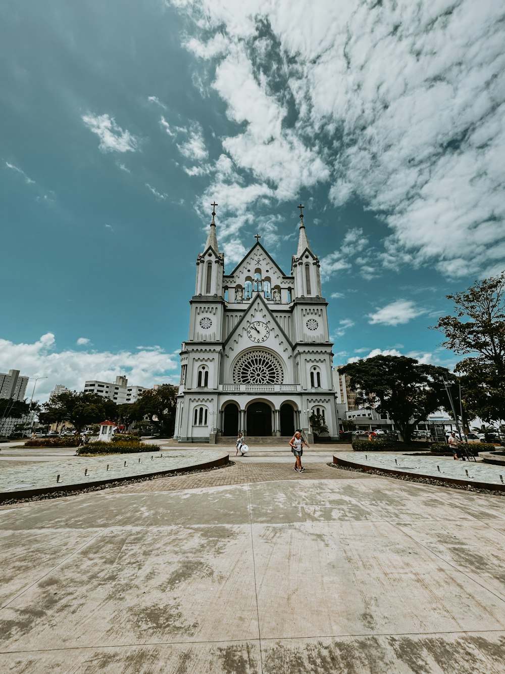 a large white church with a sky background