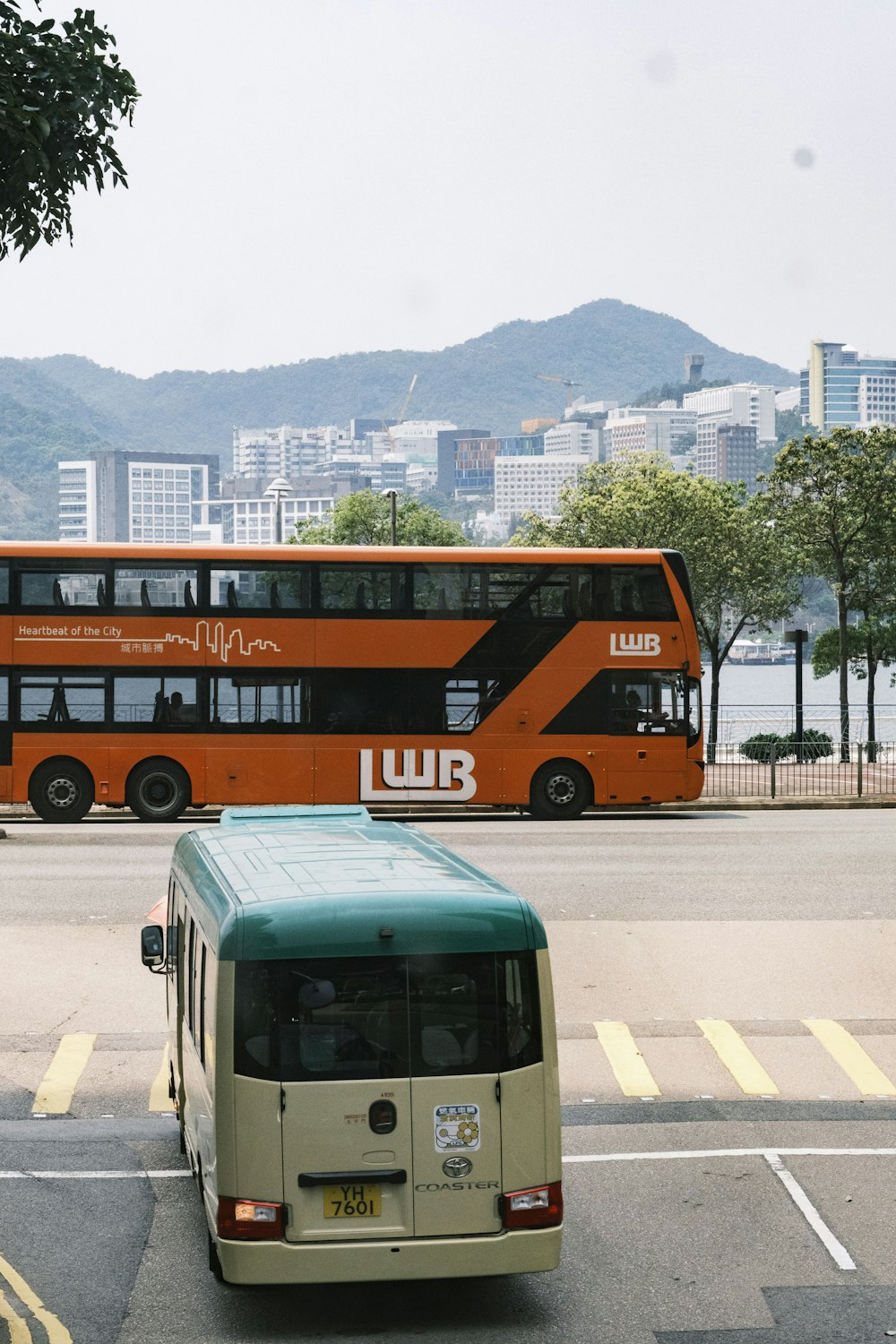 a double decker bus driving down a street