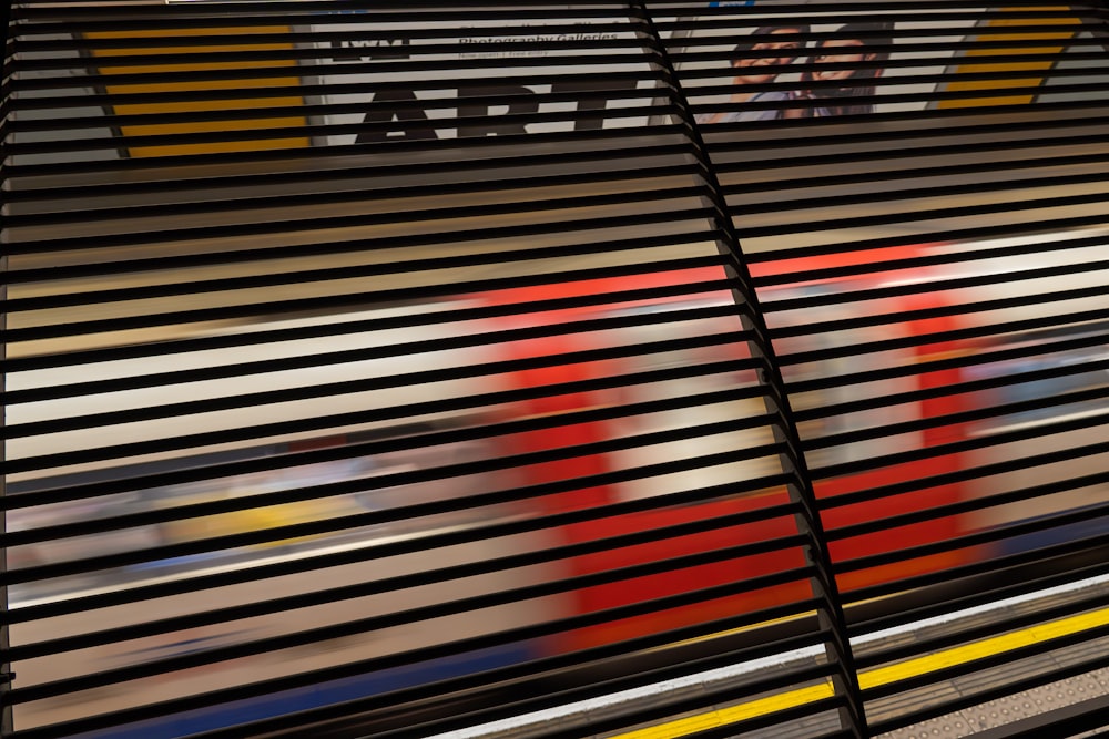 a train traveling through a train station next to a platform