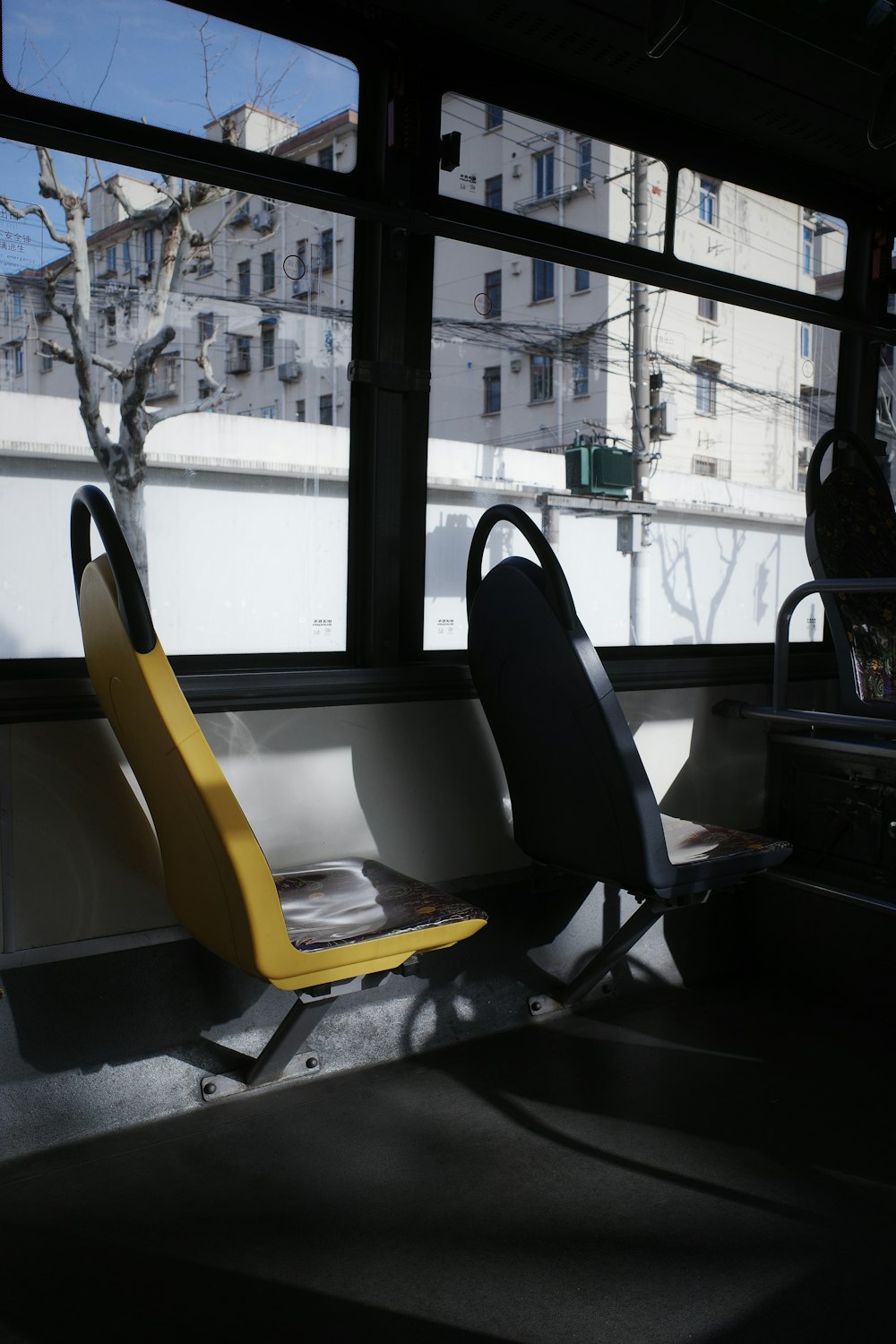 a couple of chairs sitting next to a window