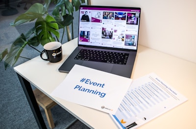 a laptop computer sitting on top of a desk