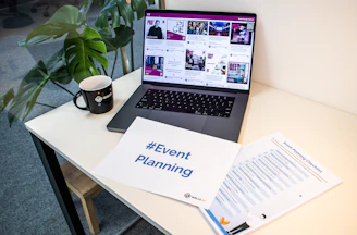 a laptop computer sitting on top of a desk