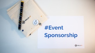 a table with a note and pen on it