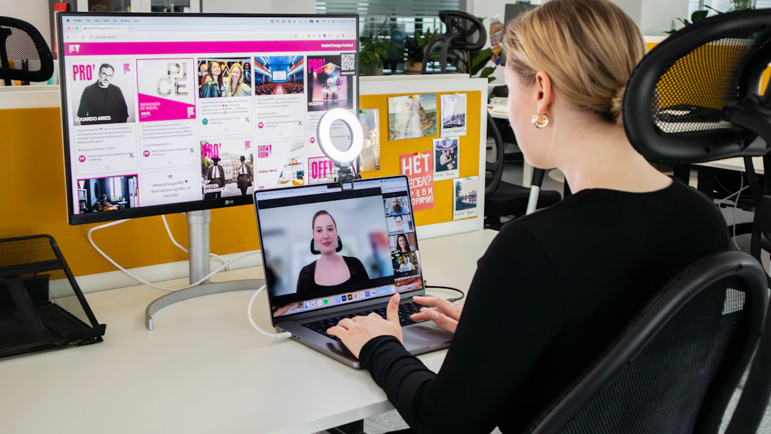 A woman working at a laptop