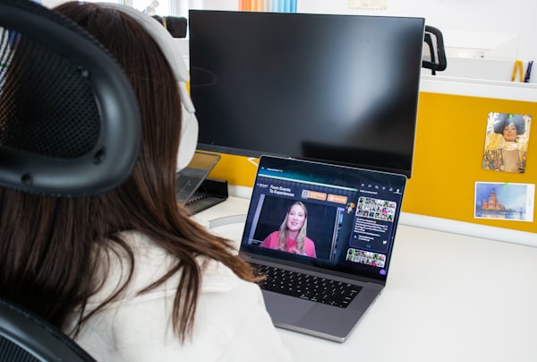 Person attending a virtual event on their laptop