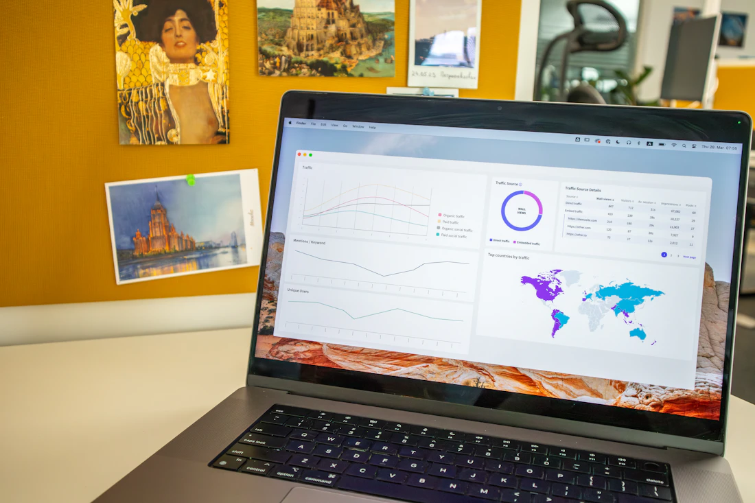 A laptop showing campaign analytics on an office desk