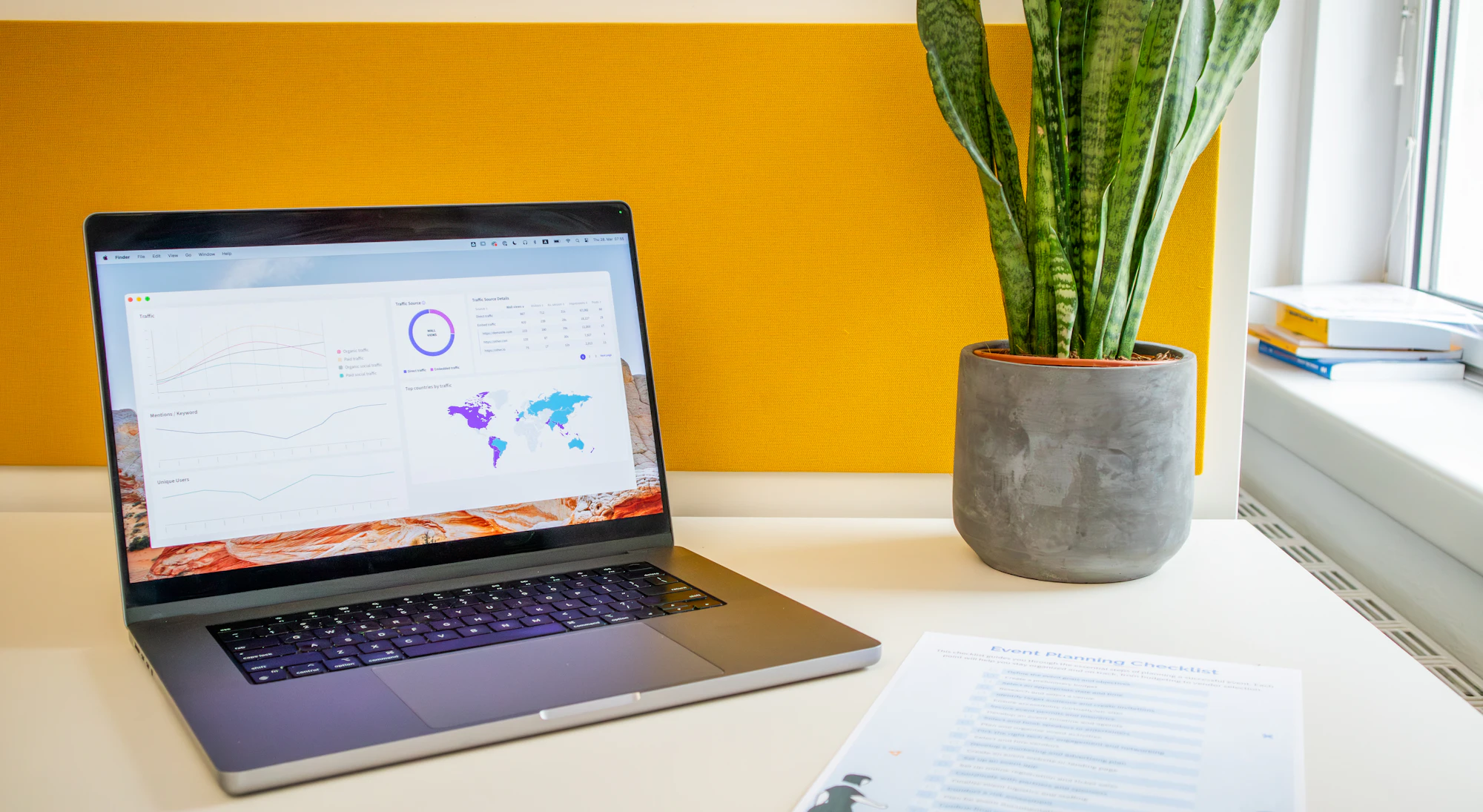 Desk workspace with overlapping marketing analytics reports showing conflicting data and metrics