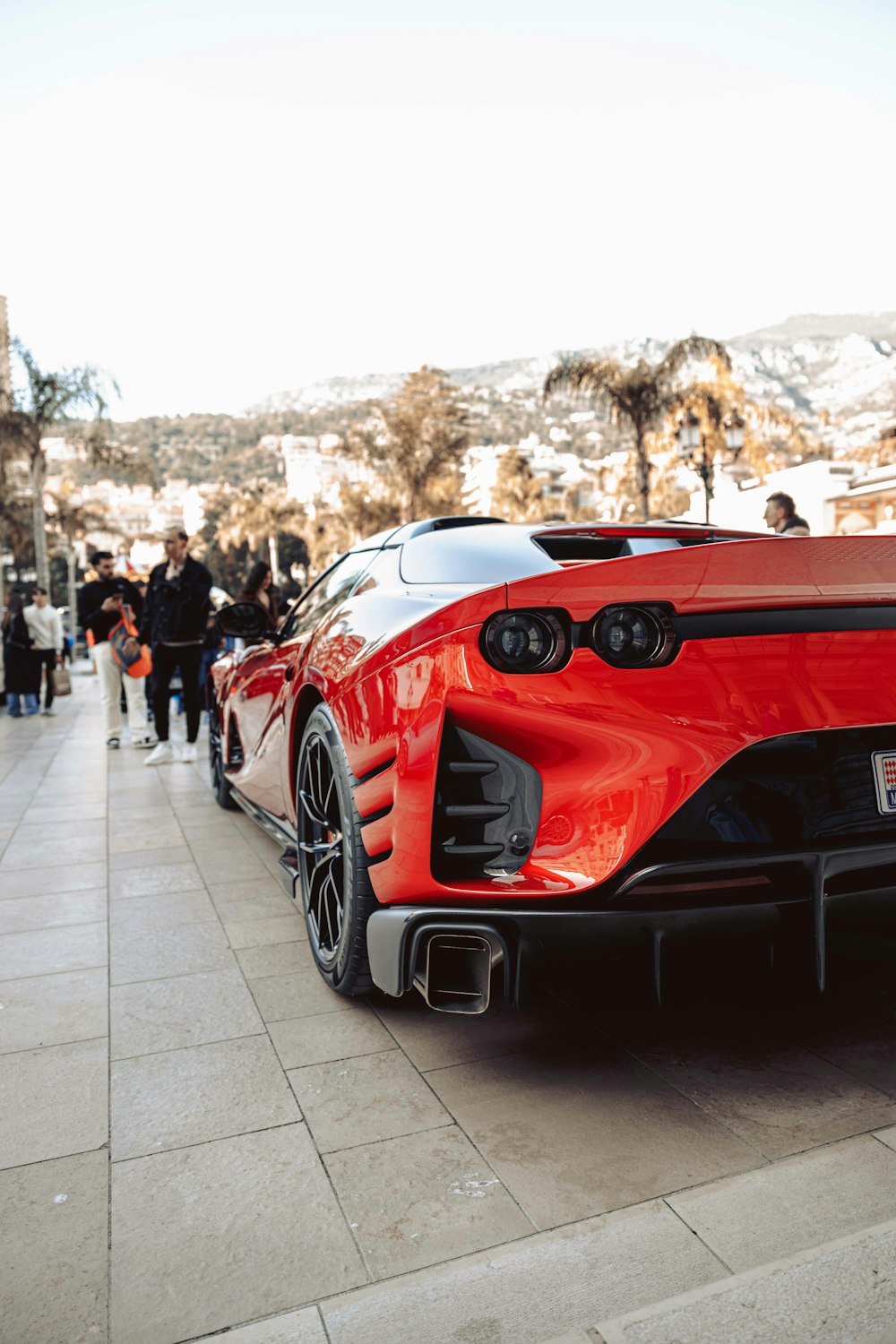 a red sports car parked on the side of a road