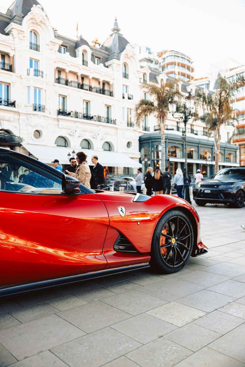 a red sports car parked on the side of the road