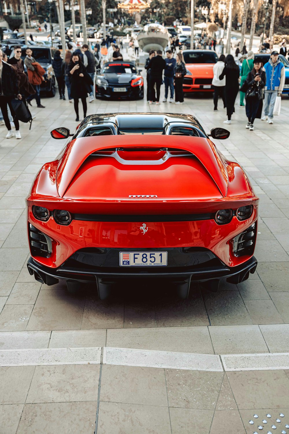 a red sports car parked on the side of the road