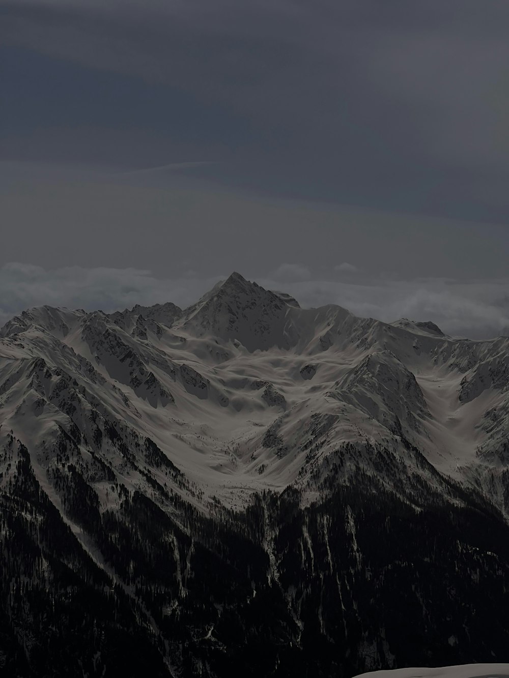 a black and white photo of a mountain range