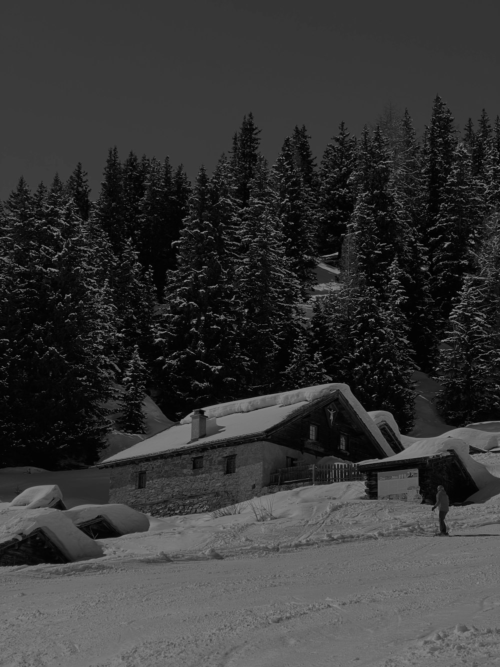 a black and white photo of a ski lodge