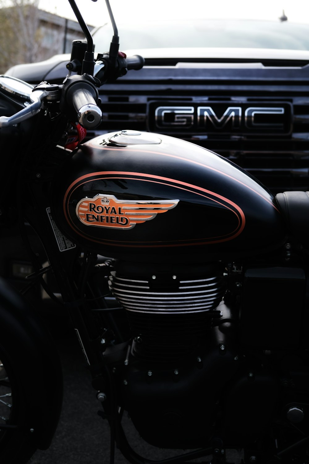a close up of a motorcycle parked in a parking lot
