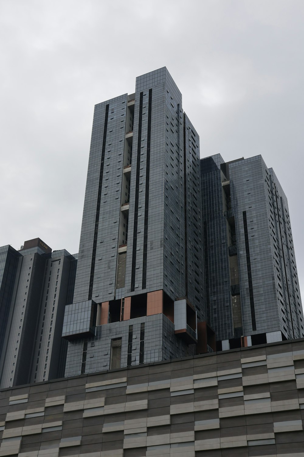 a very tall building sitting next to a very tall building