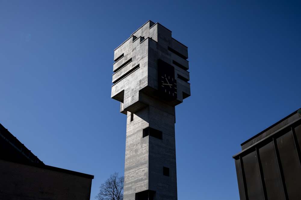 a tall tower with a clock on the top of it