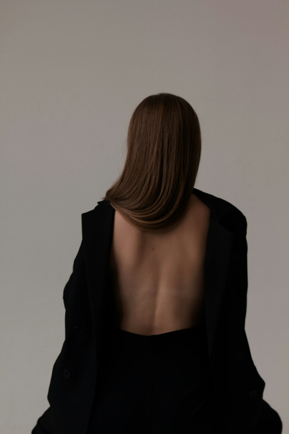 the back of a woman's head and shoulders