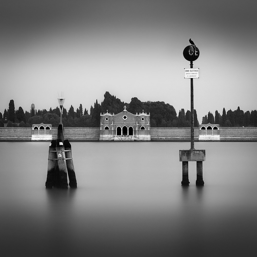 a black and white photo of a building and a clock