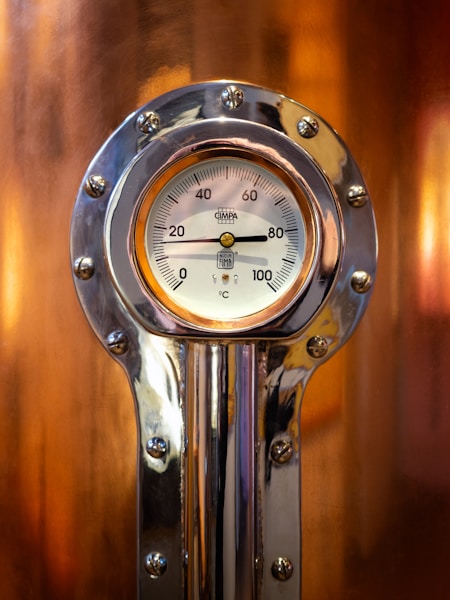 Close-up of a pressure gauge on a wall, representing a calibrated confidence threshold that decides when a workflow should abstain