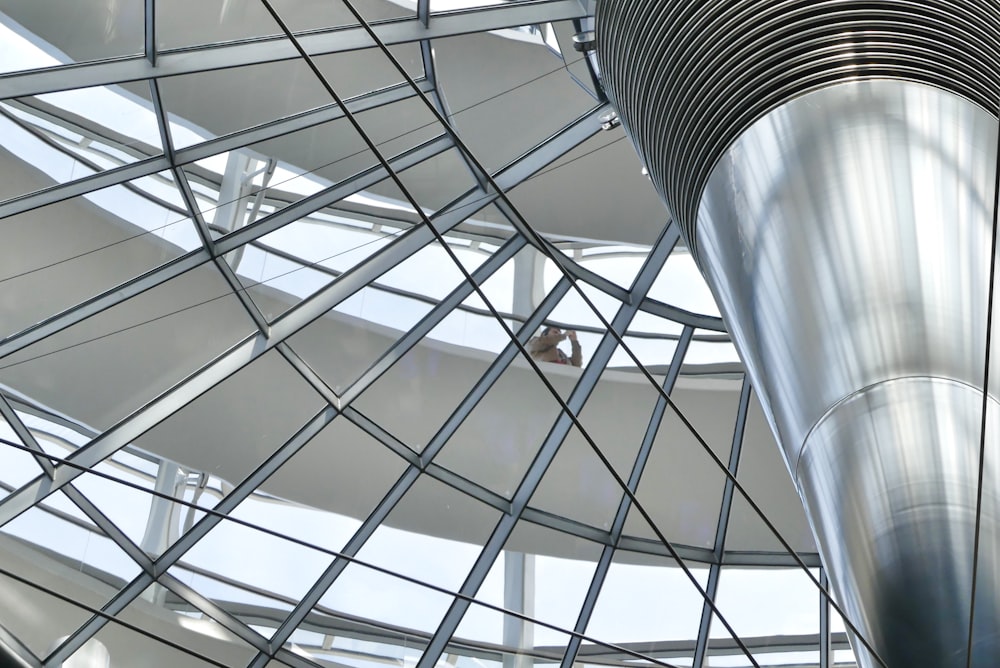 a large metal structure with a skylight in the background