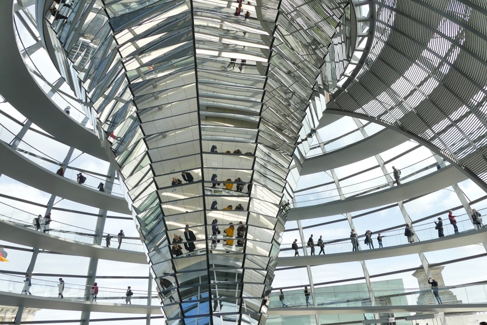 a group of people standing inside of a building