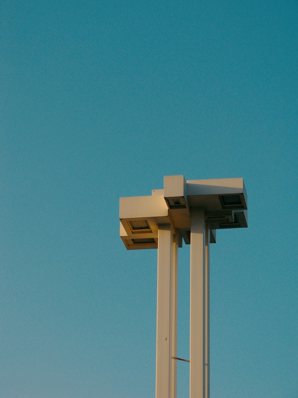 a clock tower with a blue sky in the background