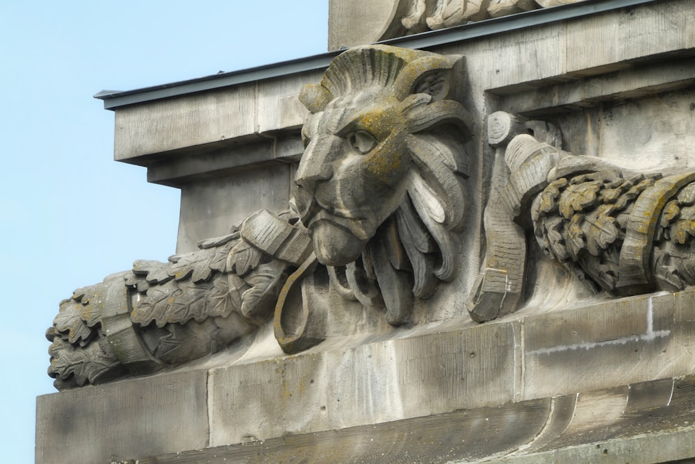 a gargoyle sculpture on the side of a building