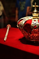 a crown sitting on top of a red table