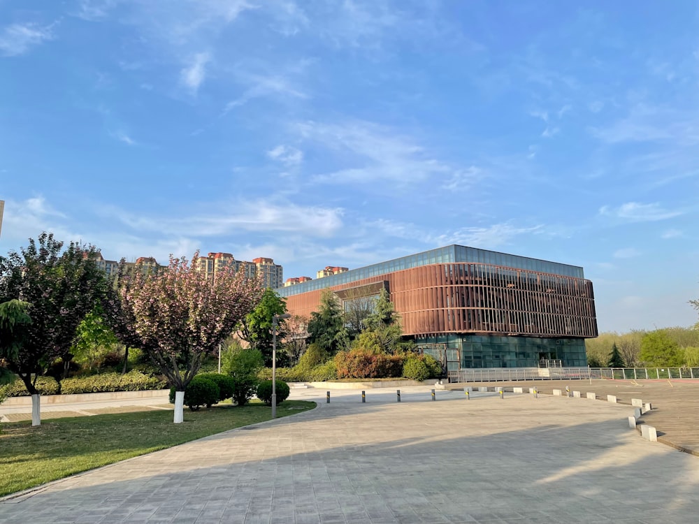 a large building sitting on top of a lush green field